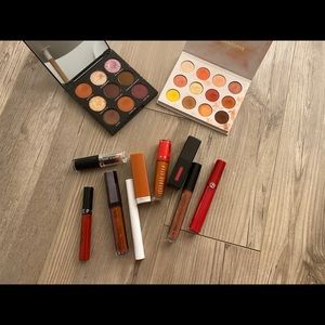 a set of lipsticks and two palettes